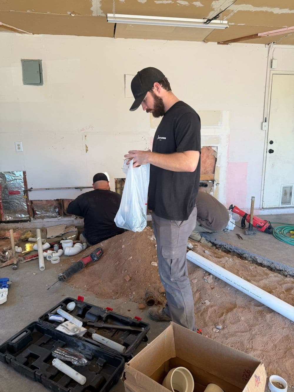 The Dam Plumber team on a garage sewer repair job